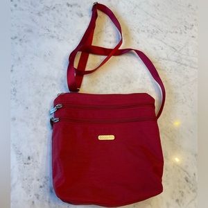 Baggalinni Red Crossbody Bag with three deep front pockets and one back zipper